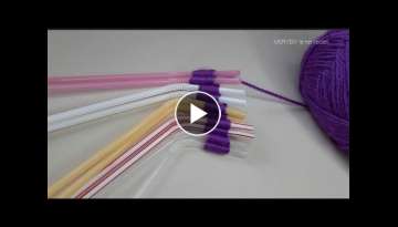 Making flowers from yarn with a juice straw